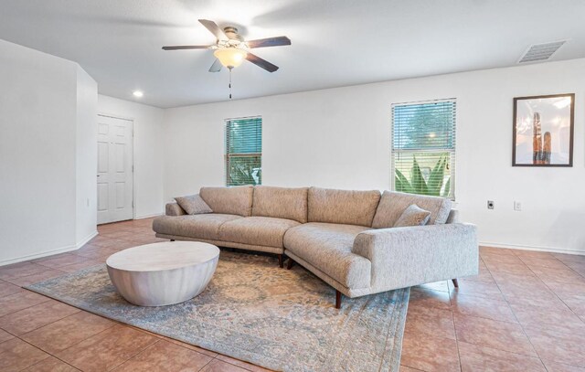 8936 Milton Lease Dr, Austin, TX 78747 - living area featuring a ceiling fan, light tile patterned flooring, baseboards, and recessed lighting