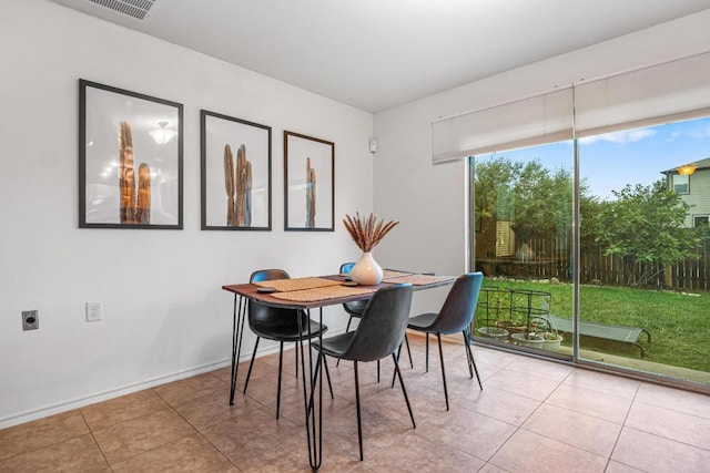 8936 Milton Lease Dr, Austin, TX 78747 - dining room featuring light tile patterned floors and baseboards