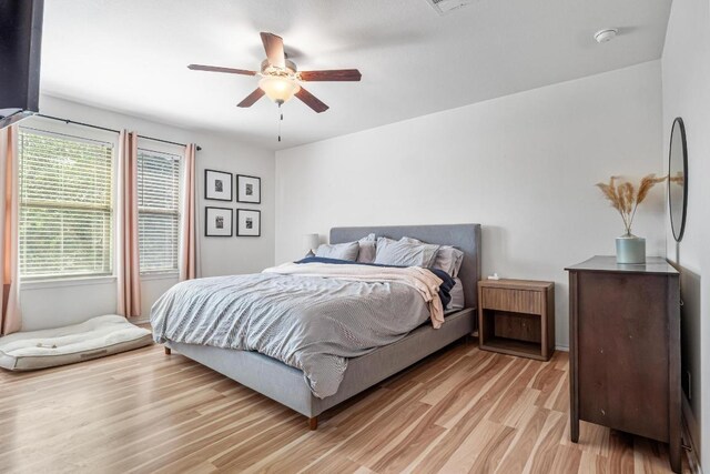 8936 Milton Lease Dr, Austin, TX 78747 - bedroom featuring light wood-style floors and a ceiling fan