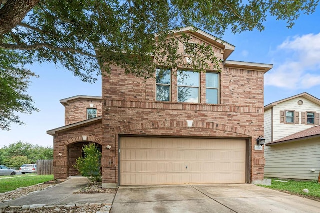 8936 Milton Lease Dr, Austin, TX 78747 - traditional-style house with an attached garage, brick siding, and concrete driveway