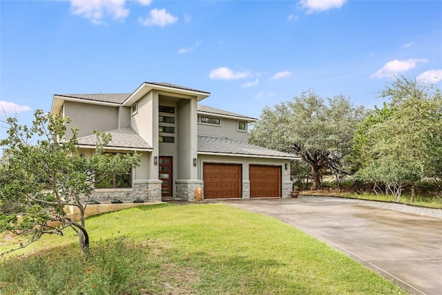 18700 Venture Dr, Point Venture, TX 78645 - prairie-style house featuring stone siding, concrete driveway, an attached garage, a front lawn, and stucco siding