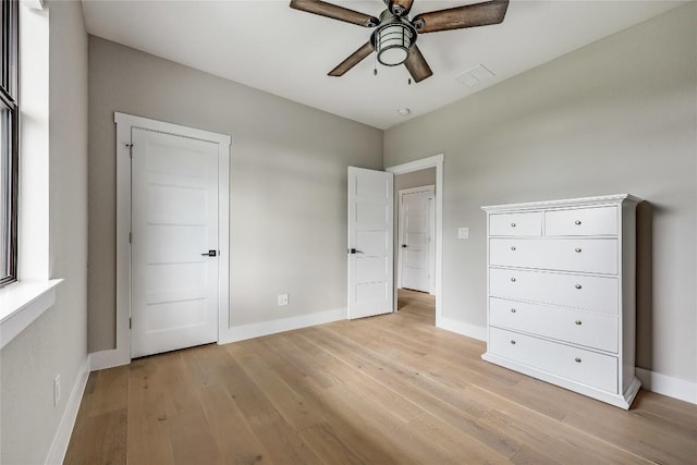 18700 Venture Dr, Point Venture, TX 78645 - unfurnished bedroom featuring light wood-type flooring and a ceiling fan