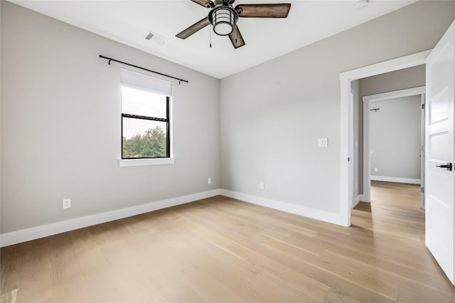 18700 Venture Dr, Point Venture, TX 78645 - empty room featuring light wood finished floors and a ceiling fan
