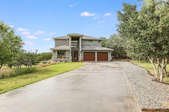 18700 Venture Dr, Point Venture, TX 78645 - prairie-style house with stone siding, concrete driveway, a garage, a front yard, and stucco siding