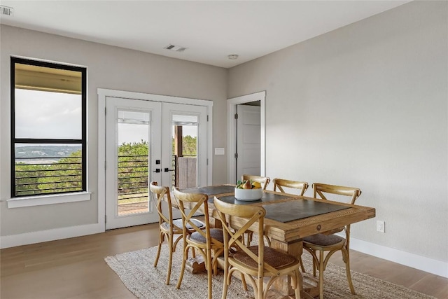 18700 Venture Dr, Point Venture, TX 78645 - dining room featuring french doors and wood finished floors