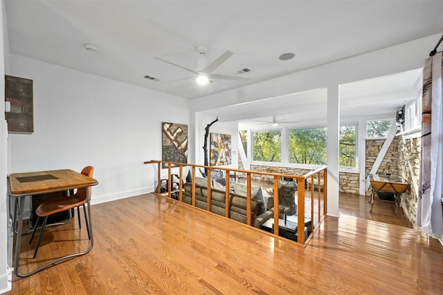 525 Barton Blvd, Austin, TX 78704 - hallway with wood finished floors, an upstairs landing, and baseboards