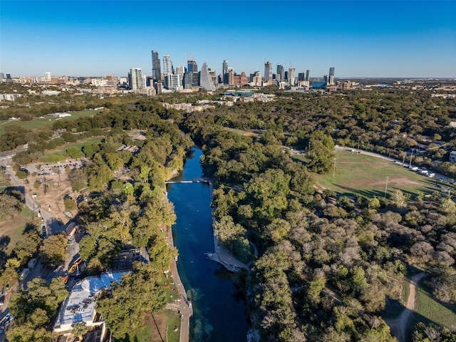 525 Barton Blvd, Austin, TX 78704 - aerial view of property's location featuring skyline, a nearby body of water, and a tree filled landscape