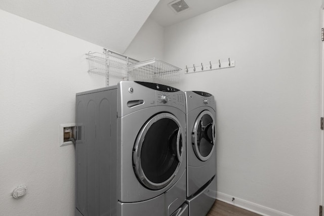 328 Palo Alto Way, Austin, TX 78732 - laundry room featuring washer and clothes dryer, baseboards, and dark wood-style floors
