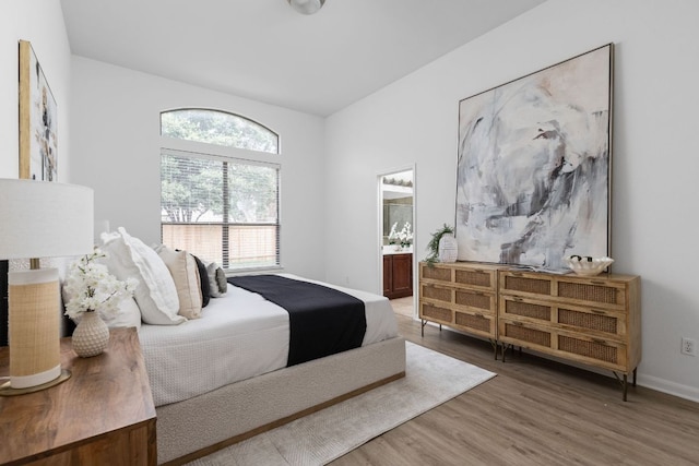 328 Palo Alto Way, Austin, TX 78732 - bedroom featuring wood finished floors, ensuite bathroom, and baseboards