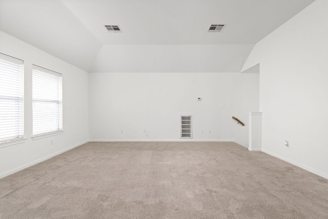 328 Palo Alto Way, Austin, TX 78732 - empty room featuring lofted ceiling, light carpet, and baseboards