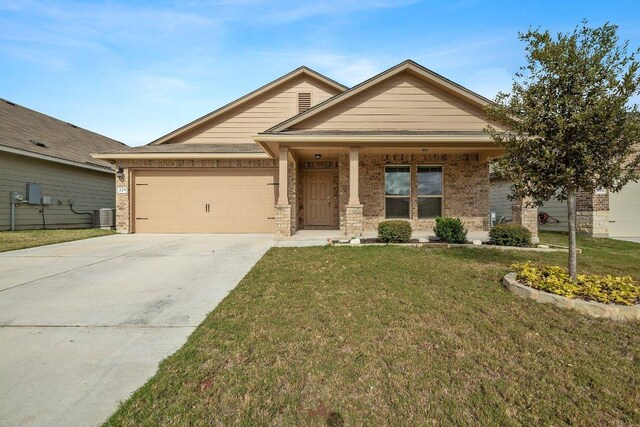 229 Reagor Dr, Taylor, TX 76574 - view of front of property with brick siding, a garage, concrete driveway, and a front yard
