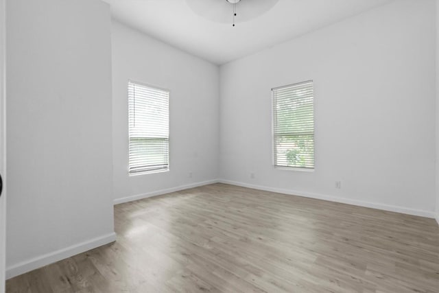 204 E Brenham St, Elgin, TX 78621 - empty room with ceiling fan, light wood-style floors, and baseboards