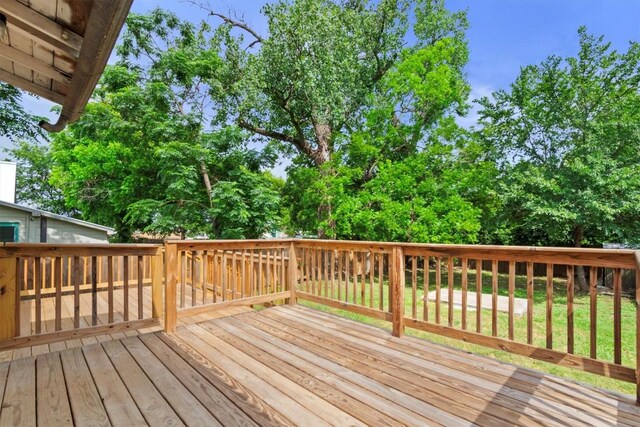 204 E Brenham St, Elgin, TX 78621 - deck featuring a yard and view of wooded area
