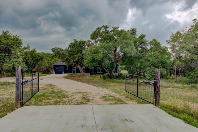 13401 Trail Driver, Austin, TX 78737 - view of front of property with a gate, driveway, and a garage