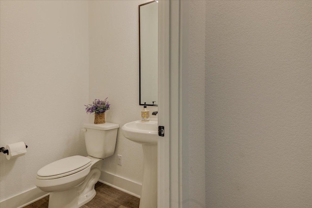 13401 Trail Driver, Austin, TX 78737 - half bathroom featuring toilet and wood finished floors
