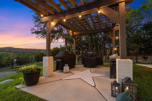 19407 White Horse Cv, Spicewood, TX 78669 - patio terrace at dusk with a pergola, grilling area, and a patio