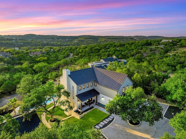 19407 White Horse Cv, Spicewood, TX 78669 - aerial view at dusk of a wooded view