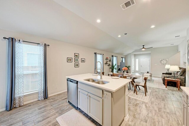 133 Free Stone Dr, Georgetown, TX 78628 - kitchen featuring a sink, stainless steel dishwasher, open floor plan, ceiling fan, and light countertops