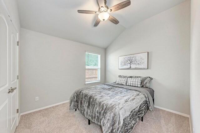 133 Free Stone Dr, Georgetown, TX 78628 - carpeted bedroom with lofted ceiling, baseboards, and a ceiling fan