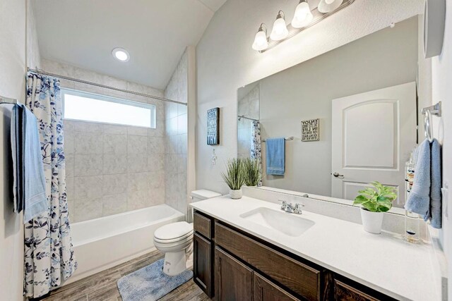 133 Free Stone Dr, Georgetown, TX 78628 - full bathroom featuring toilet, vanity, shower / tub combo with curtain, and wood finished floors