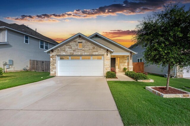 133 Free Stone Dr, Georgetown, TX 78628 - view of front of property featuring stone siding, concrete driveway, and an attached garage