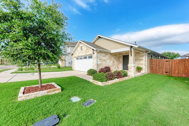 133 Free Stone Dr, Georgetown, TX 78628 - view of front of home with stone siding, an attached garage, and concrete driveway