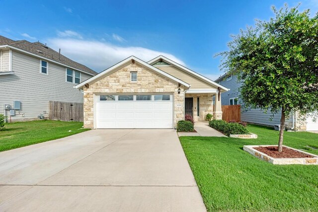 133 Free Stone Dr, Georgetown, TX 78628 - view of front of house featuring stone siding, driveway, and a garage