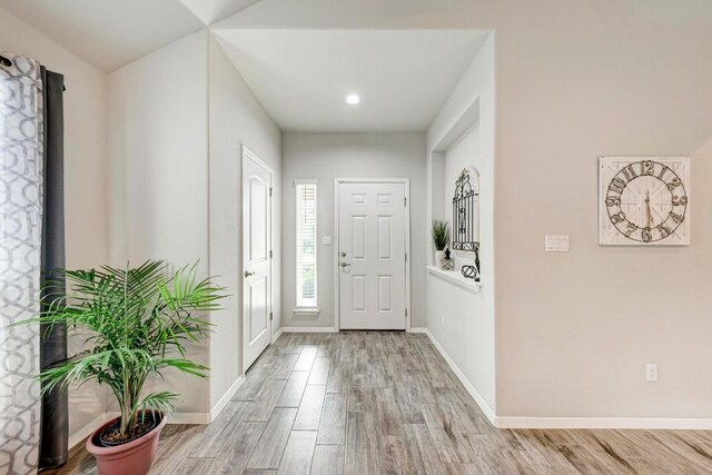 133 Free Stone Dr, Georgetown, TX 78628 - foyer entrance with light wood finished floors, baseboards, and recessed lighting