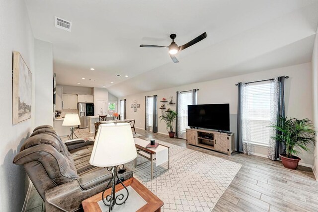 133 Free Stone Dr, Georgetown, TX 78628 - living area featuring a ceiling fan, baseboards, light wood-style flooring, and lofted ceiling