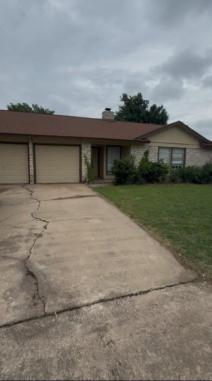 1304 Wroxton Way, Round Rock, TX 78664 - view of front facade featuring a front lawn, driveway, a garage, and a chimney
