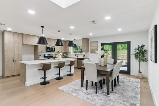 2322 Westoak Dr, Austin, TX 78704 - dining room featuring light wood-type flooring, plenty of natural light, and recessed lighting