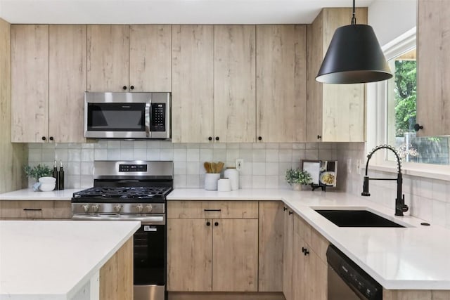 2322 Westoak Dr, Austin, TX 78704 - kitchen featuring appliances with stainless steel finishes, decorative backsplash, light countertops, and light brown cabinets