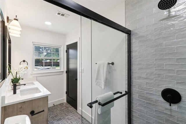 2322 Westoak Dr, Austin, TX 78704 - bathroom with a stall shower, double vanity, and recessed lighting