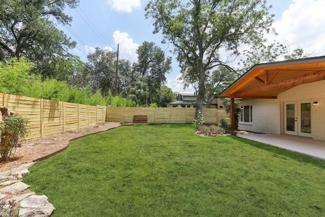 2322 Westoak Dr, Austin, TX 78704 - fenced backyard with french doors and a patio