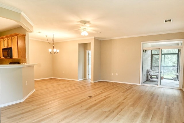 115 Dickens Cir, Georgetown, TX 78633 - unfurnished living room featuring light wood finished floors, a chandelier, crown molding, and a ceiling fan