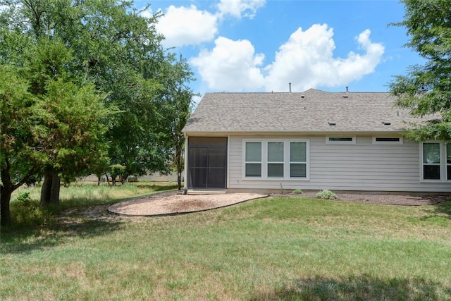 115 Dickens Cir, Georgetown, TX 78633 - rear view of property featuring a lawn, a patio, and a shingled roof