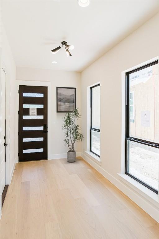 1201 Friends Cv, Round Rock, TX 78681 - foyer entrance featuring a ceiling fan and light wood-style flooring