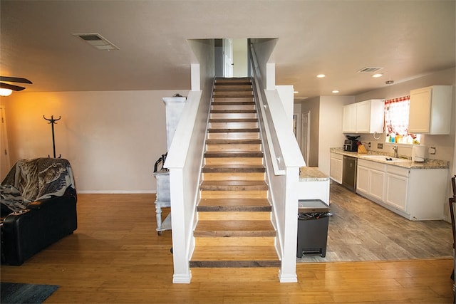 2723 Moonmist Cv, Round Rock, TX 78665 - stairway with wood finished floors, a ceiling fan, and recessed lighting