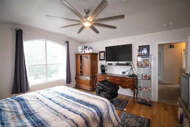 2723 Moonmist Cv, Round Rock, TX 78665 - bedroom featuring vaulted ceiling, wood finished floors, and a ceiling fan