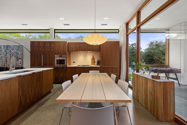 6506 Arroyo Seco, Austin, TX 78757 - dining room featuring healthy amount of natural light and a wall of windows