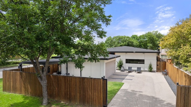 6506 Arroyo Seco, Austin, TX 78757 - modern home with a garage and decorative driveway