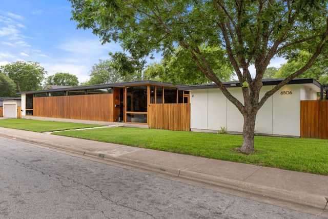 6506 Arroyo Seco, Austin, TX 78757 - mid-century home with an exterior structure and an outbuilding