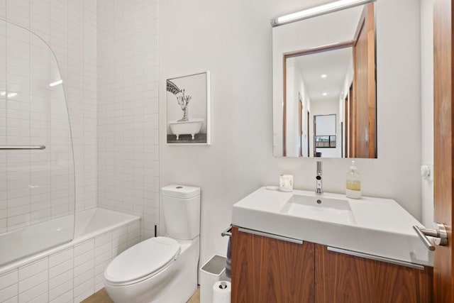 6506 Arroyo Seco, Austin, TX 78757 - full bathroom featuring vanity, toilet, and tiled shower / bath