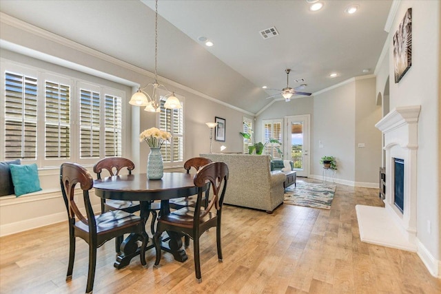 2416 Montello Ct, Leander, TX 78641 - dining area featuring light wood-style floors, crown molding, ceiling fan, a chandelier, and recessed lighting