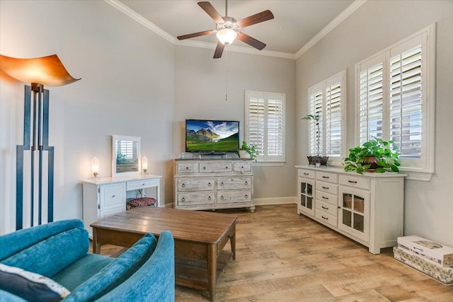 2416 Montello Ct, Leander, TX 78641 - living room featuring crown molding, light wood-style floors, ceiling fan, and a towering ceiling