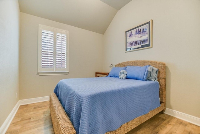 2416 Montello Ct, Leander, TX 78641 - bedroom with wood finished floors and vaulted ceiling