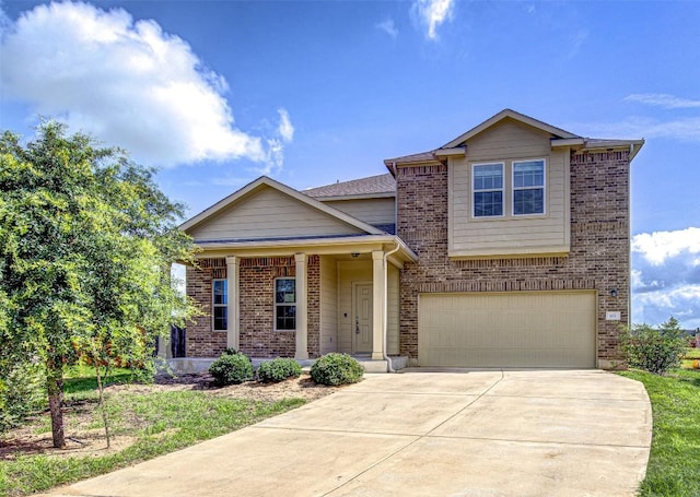 102 George Kimble Cv, Bastrop, TX 78602 - view of front of property featuring a garage, concrete driveway, brick siding, and covered porch