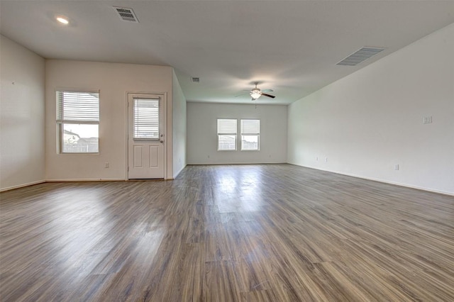102 George Kimble Cv, Bastrop, TX 78602 - spare room with a ceiling fan, wood finished floors, and baseboards