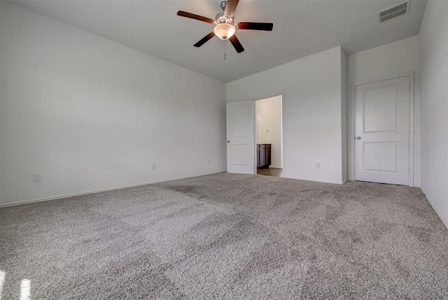 102 George Kimble Cv, Bastrop, TX 78602 - unfurnished bedroom with carpet floors, baseboards, ensuite bathroom, and a ceiling fan