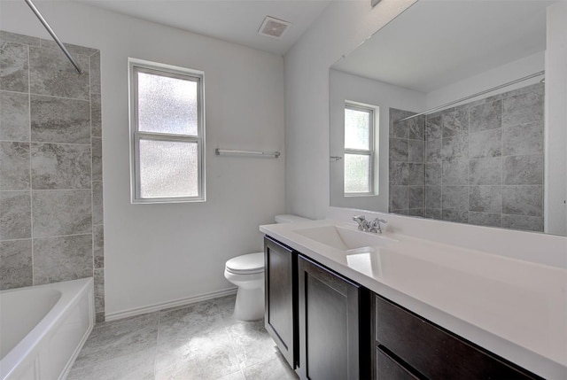 102 George Kimble Cv, Bastrop, TX 78602 - full bath featuring toilet, vanity, baseboards, and shower / bath combination
